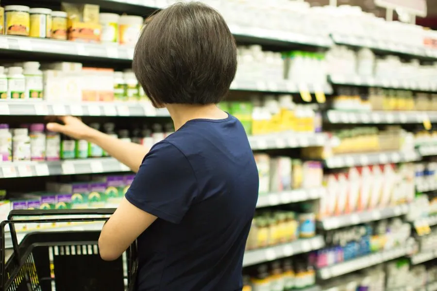 Woman buying beauty supplements